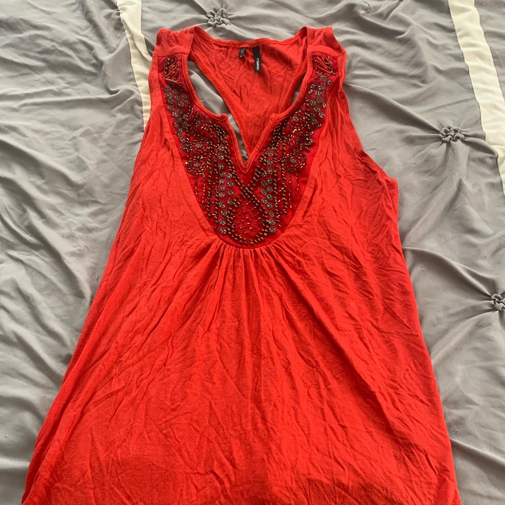 Maurice’s red racer back tank